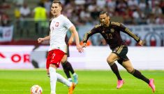 Arkadiusz Milik w meczu z Niemcami. Obok Leroy Sane (fot. Getty).